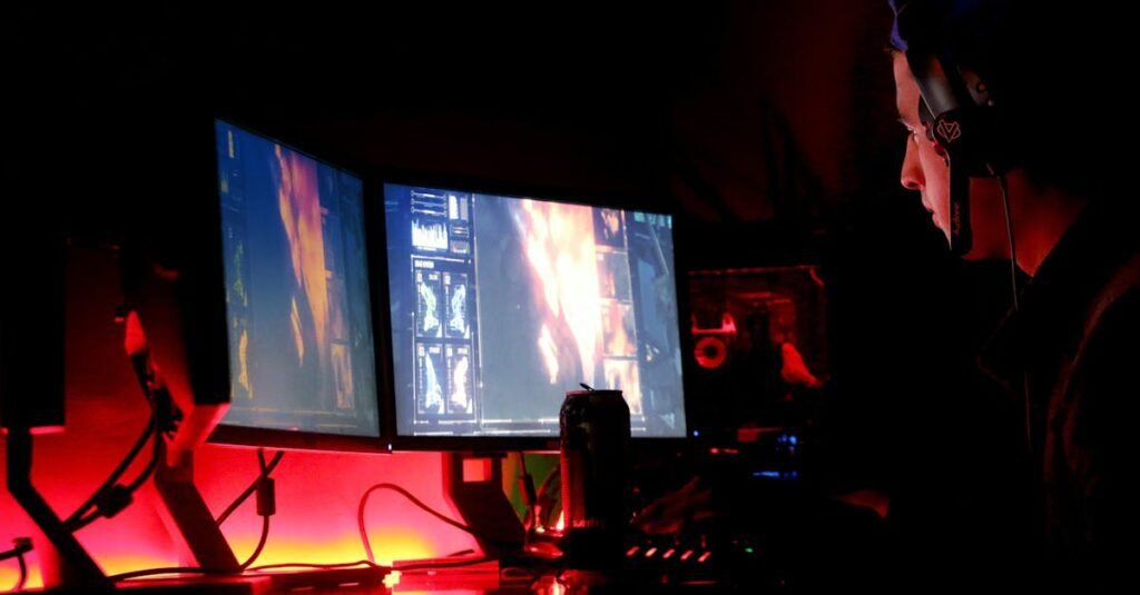 Great Indian Festival - Best Deals on PC Accessories A man intensely focused on multiple computer monitors in a dimly lit room, illustrating high-tech work environment.